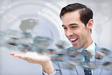 Pleased businessman looking at a picture whirl