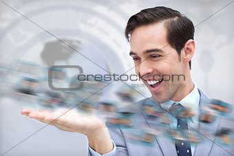 Pleased businessman looking at a picture whirl