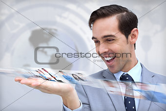 Happy businessman looking at a picture stream