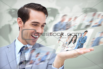 Content businessman looking at pictures