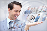 Joyful businessman looking at pictures