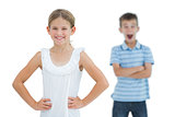 Cute young girl posing while her brother being shocked
