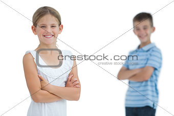 Smiling young girl posing with her brother