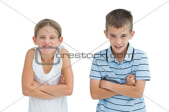 Smiling brother and sister posing together