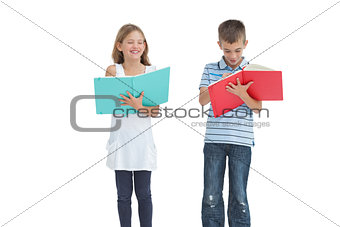 Brother and sister doing their homework together