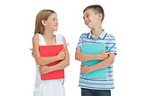 Smiling brother and sister holding their exercise books
