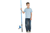 Pensive young boy holding fishing rod