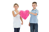 Children holding heart shaped soft toy