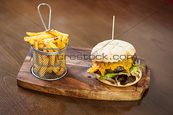 Close up on a cheese burger and french fries