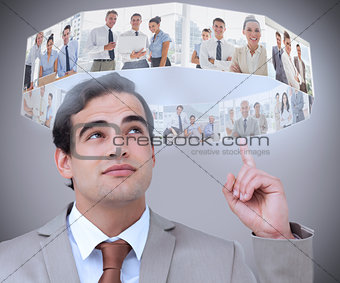Businessman showing futuristic interface above his head