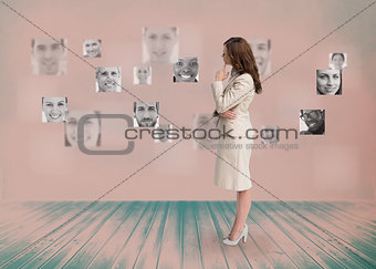 Businesswoman looking at digital interface in black and white