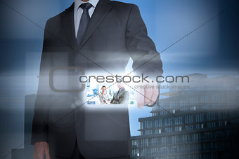 Stylish businessman using digital interface