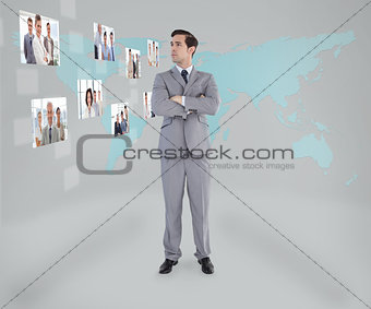 Businessman standing looking at digital interface