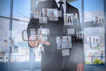 Stylish businessman presenting coworkers pictures