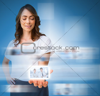 Stylish businesswoman presenting picture of coworkers