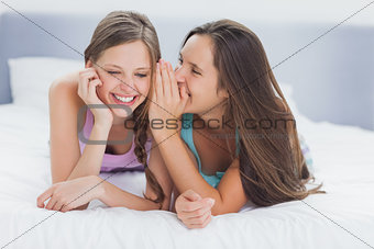 Girls lying in bed