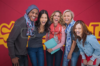 Group of cheerful friends laughing together