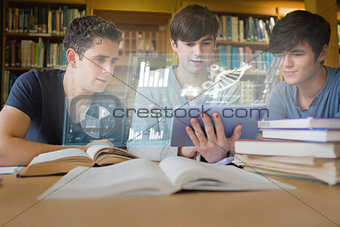 Concentrated young men studying medicine together with futuristic interface