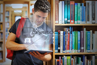 Handsome college student working on his digital tablet with futuristic interface