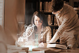 Focused college students analysing dna on digital interface