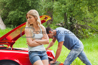 Worried couple waiting after breaking down
