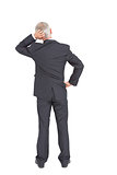 Rear view of doubtful mature businessman