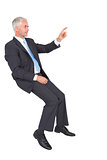 Businessman sitting and pointing