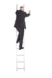 Mature businessman climbing career ladder