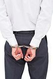 Close up on young businessman wearing handcuffs
