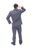 Rear view of young businessman looking away