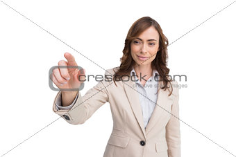 Portrait of businesswoman touching invisible screen