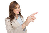 Businesswoman pressing an invisible key