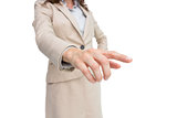 Stylish businesswoman touching invisible screen