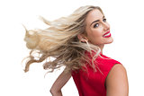 Blonde woman tossing her hair