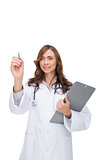 Doctor holding clipboard and pointing at something
