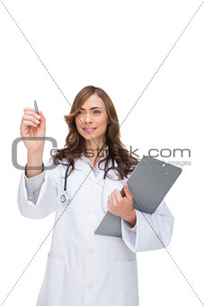Doctor holding clipboard and pointing at something