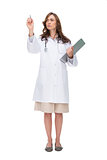 Concentrated doctor holding clipboard and pointing at something