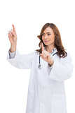 Brunette doctor posing with fingers up
