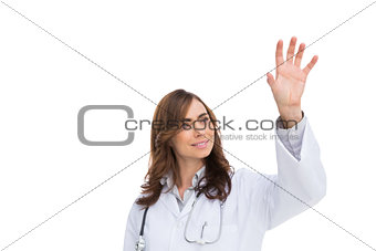 Brunette doctor reaching for something in the air