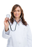 Smiling doctor holding stethoscope and looking at camera