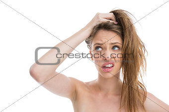 Bare natural woman making pony tail with her hair