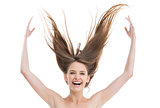 Laughing pretty woman throwing her hair up
