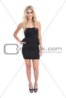 Gorgeous blonde girl in classy black dress posing
