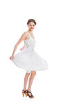 Happy pretty woman in white summer dress posing