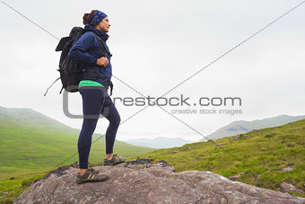 Woman standing on a rock admiring the view