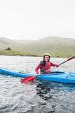 Happy woman in a kayak