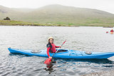 Smiling woman in a kayak