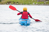 Woman rowing in a kayak
