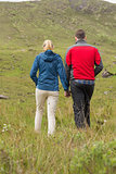 Couple holding hands and walking