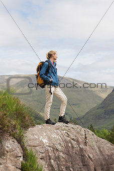 Woman standing on rock admiring the view